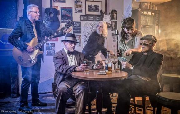 A blues band playing a bar.