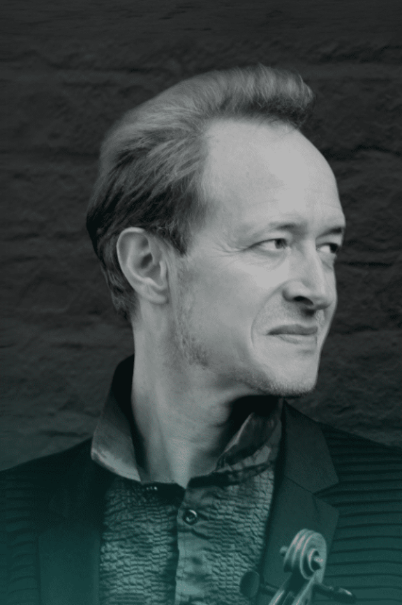 a black and white image of a man looking to his left