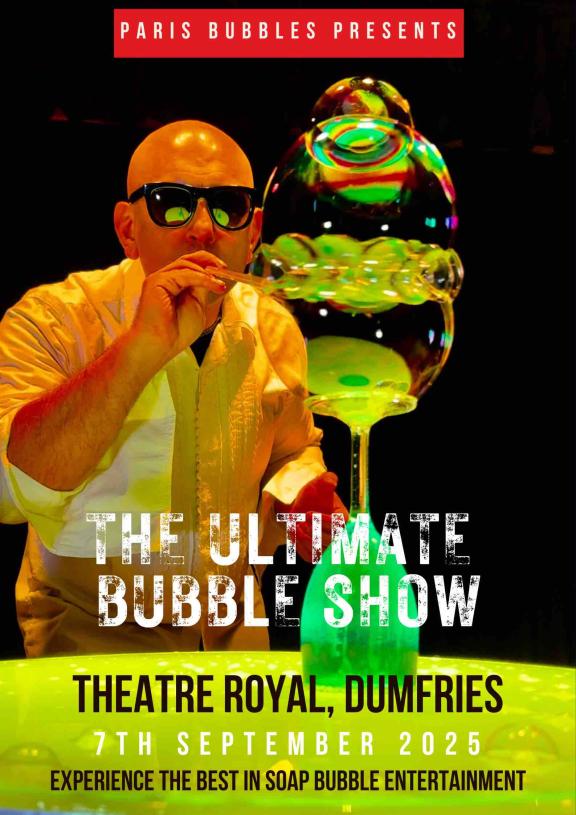 an image of a man blowing bubbles