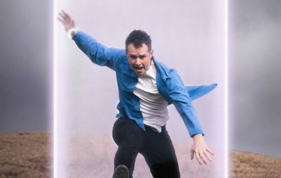 an image of a man falling through a portal