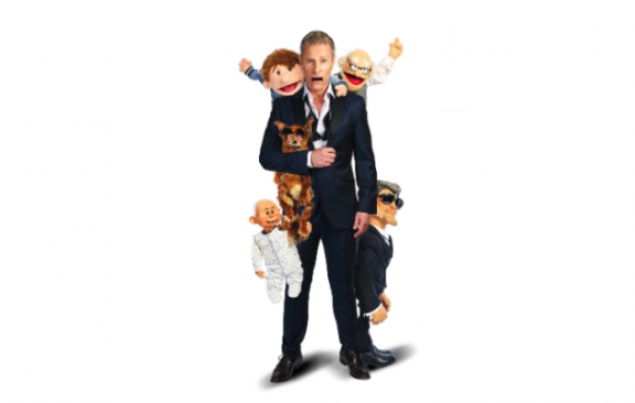 shocked man surrounded by puppets