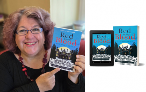 an image of a female author holding up her book