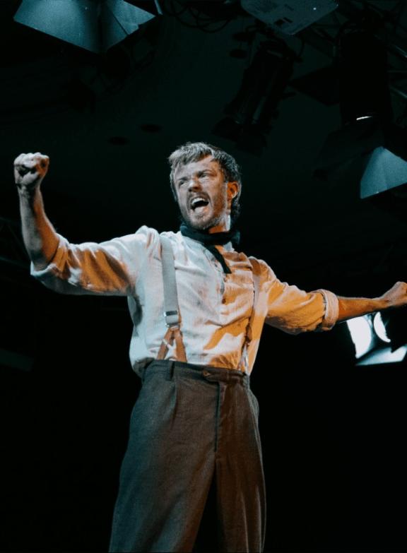 a man standing with arms outstretched