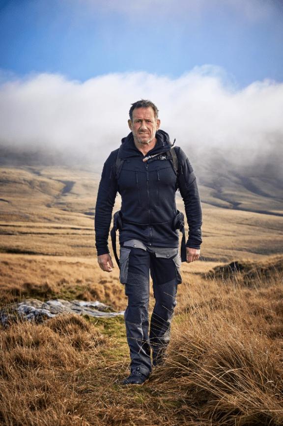 a man walking in moorland