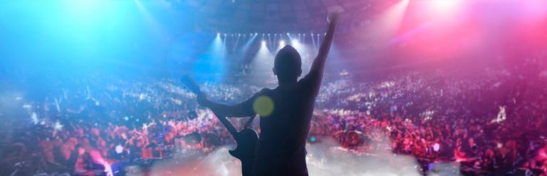 an image of a performer on stage at a rock concert