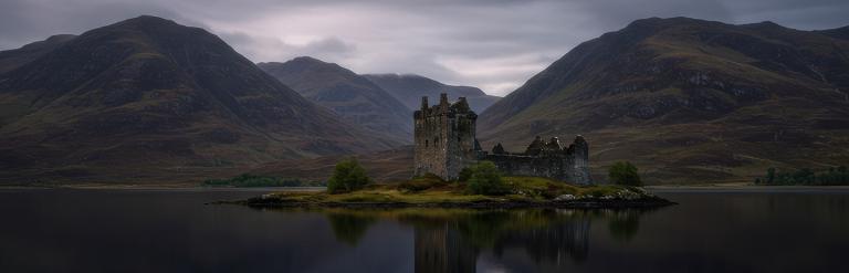 an image of a Scottish loch with a castle on a island