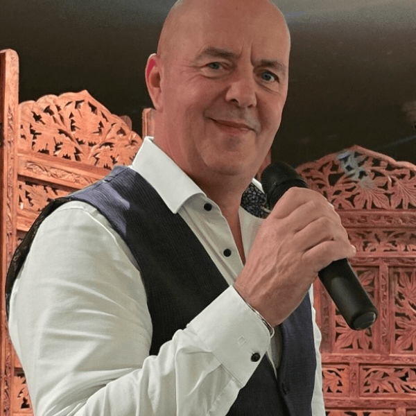 Picture of a man with a microphone.